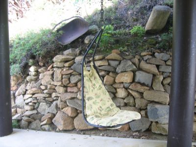 Image of an old ore shovel resting on the hillside before the fire