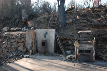 Image of the Bobcat and wood stove on clean pavement