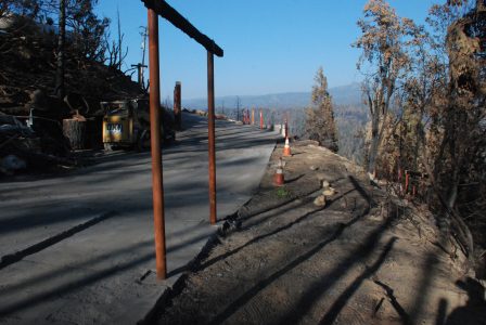 Image of only clean pavement and dirt where the hot tub once was