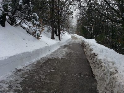 Image of plowed driveway with deep snowbanks