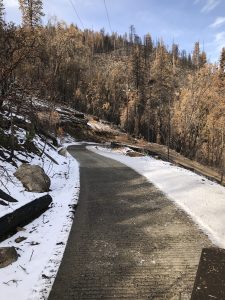 Image of driveway, half cleared of snow