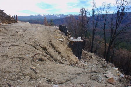 Image of deep erosion channels in steeply-sloped soils