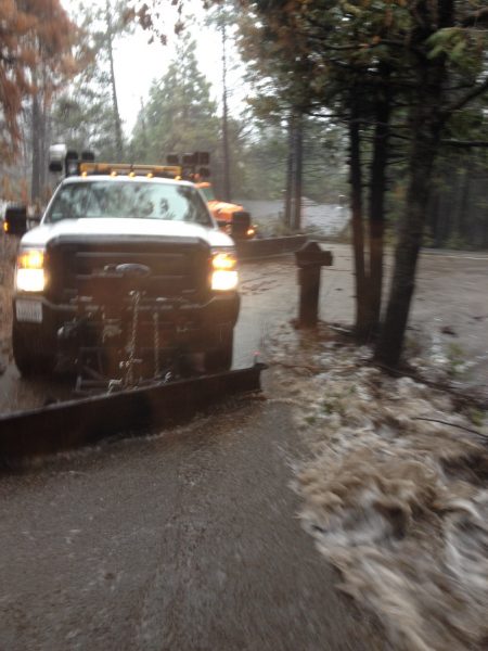 Image of a Caltrans truck surrounded by whitewater