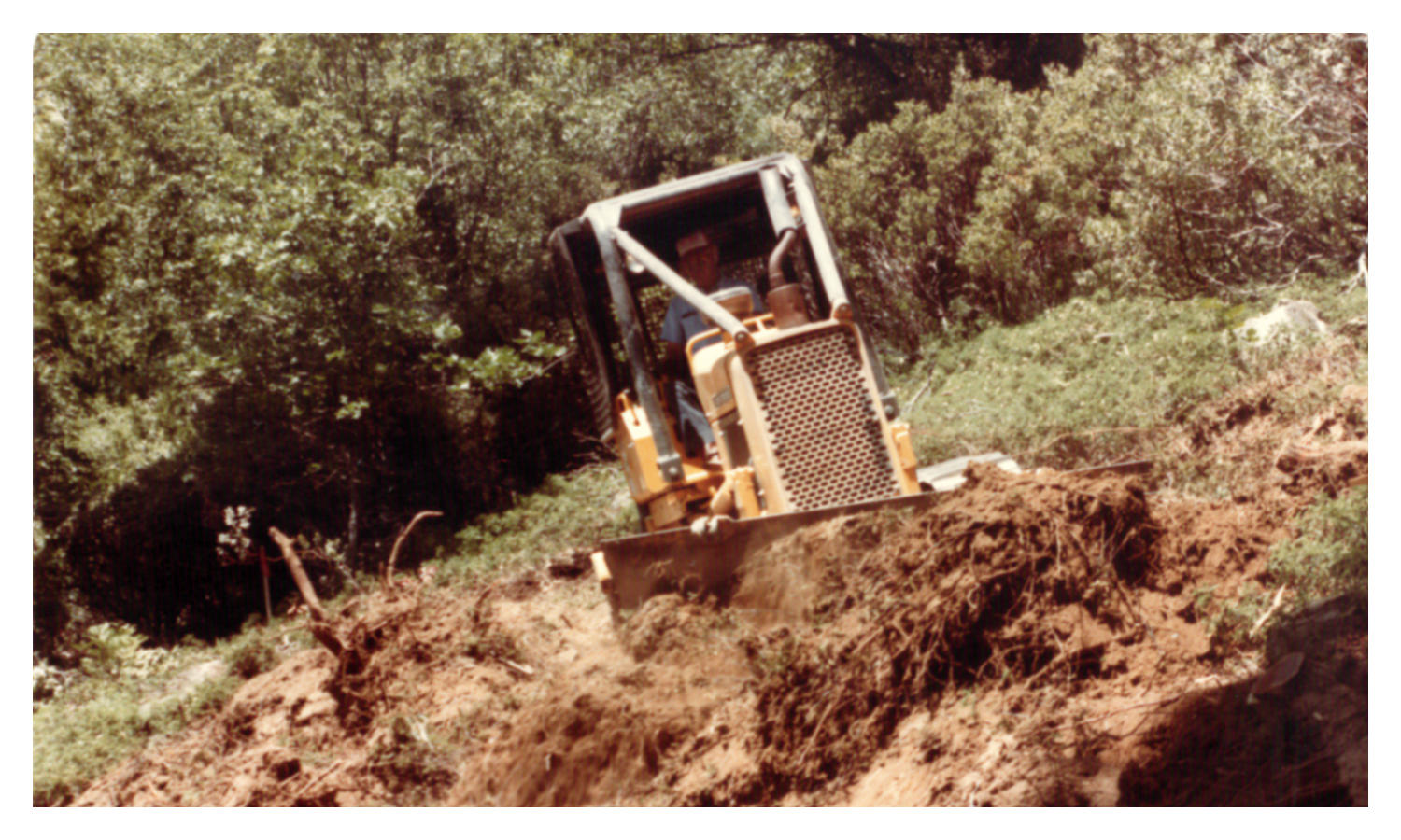 Image of a bulldozer on the hillside
