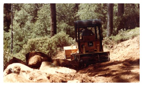 Image of a bulldozer and large rocks